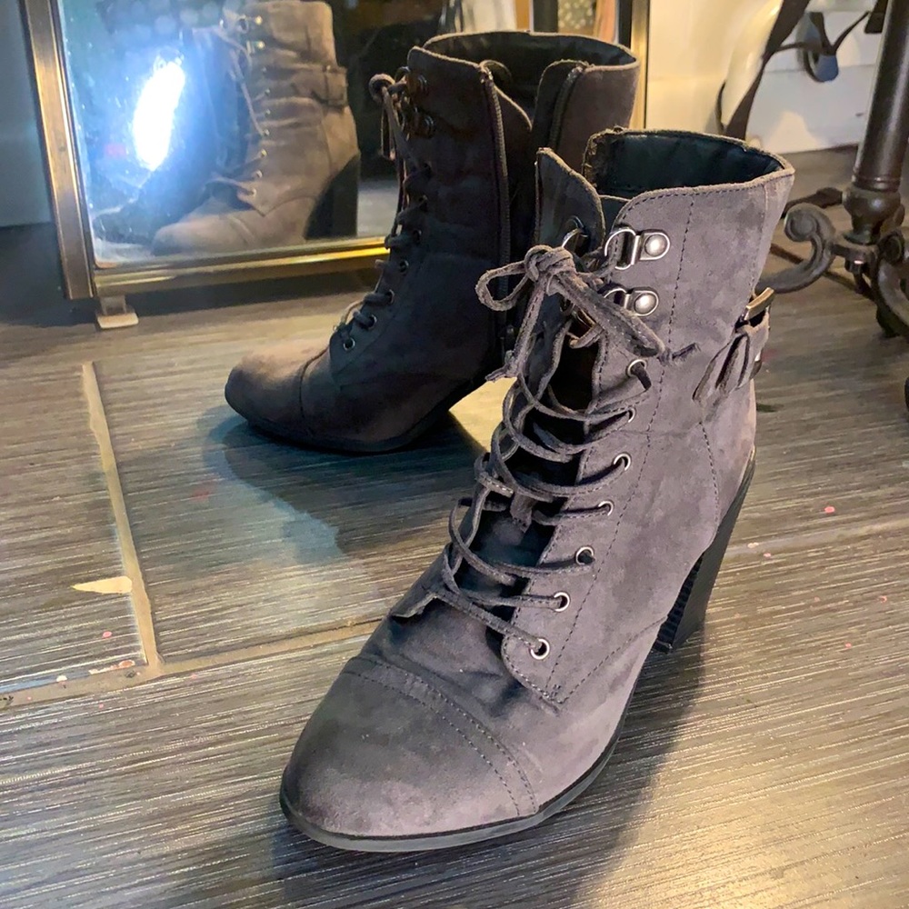 Zippered/lace up, grey ankle high, heeled boots.